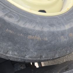 A truck tire that is very worn out