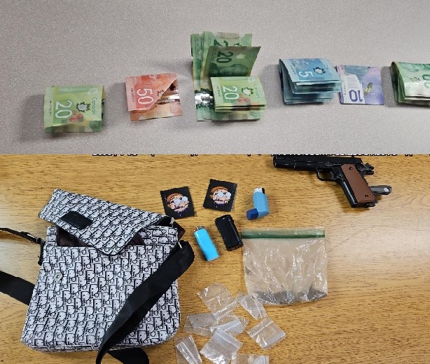 Picture of an imitation firearm and a large quantity of money