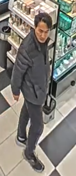 East Asian male, wearing a black jacket and black pants