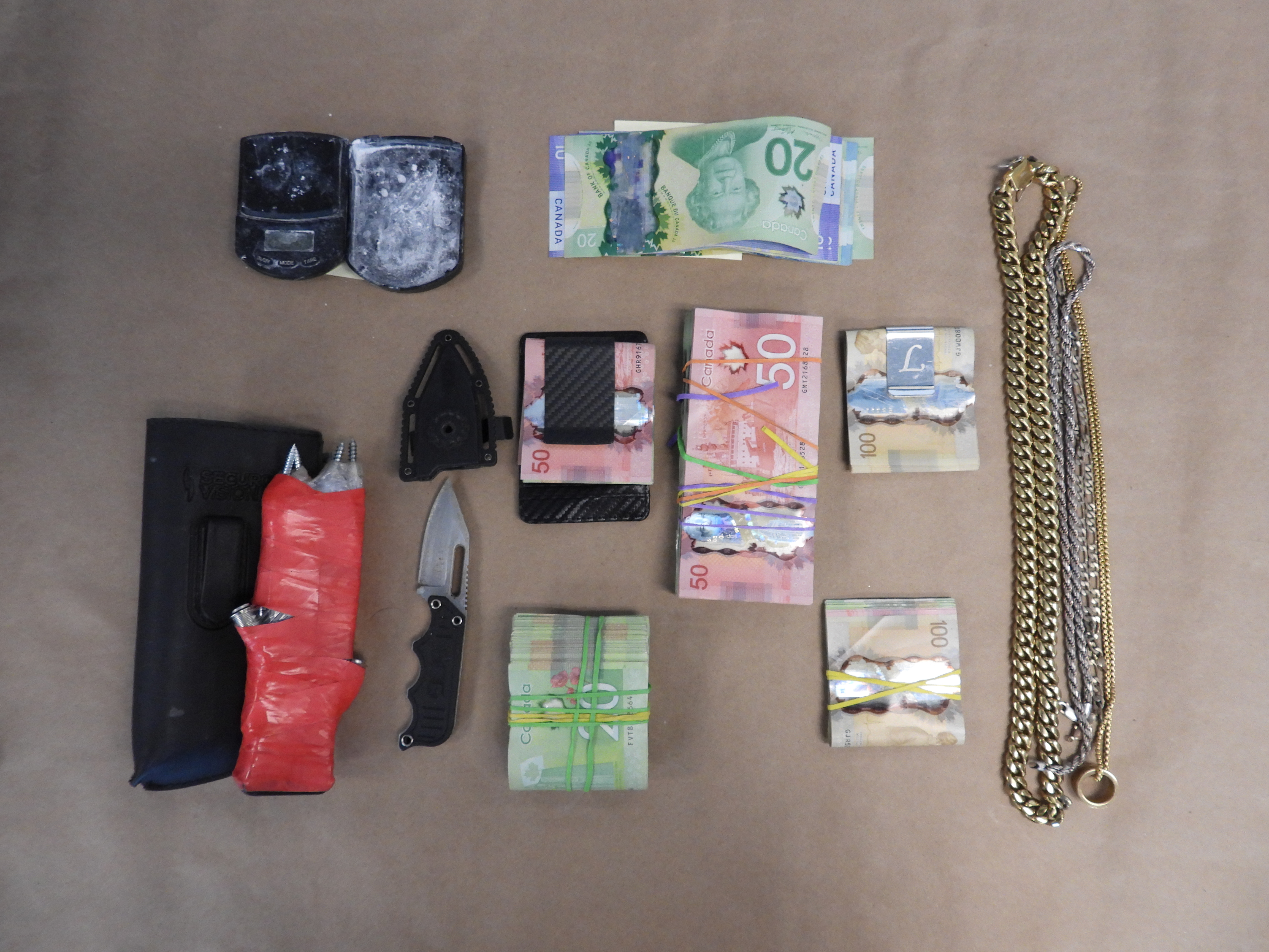 Seized weapons, cash, cell phones