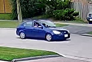 blue four door sedan