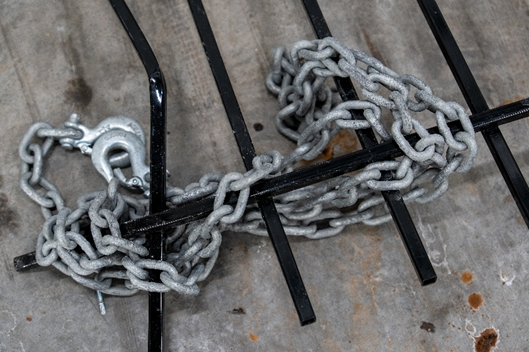 Metal chain and damaged metal door barrier