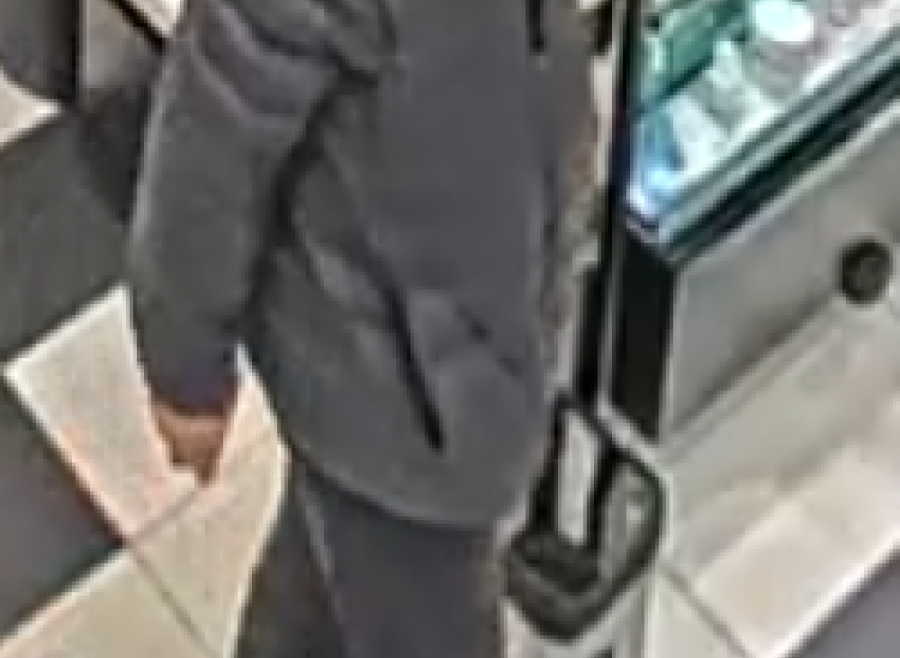 East Asian male, wearing a black jacket and black pants