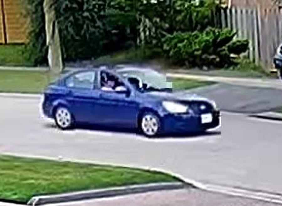 blue four door sedan