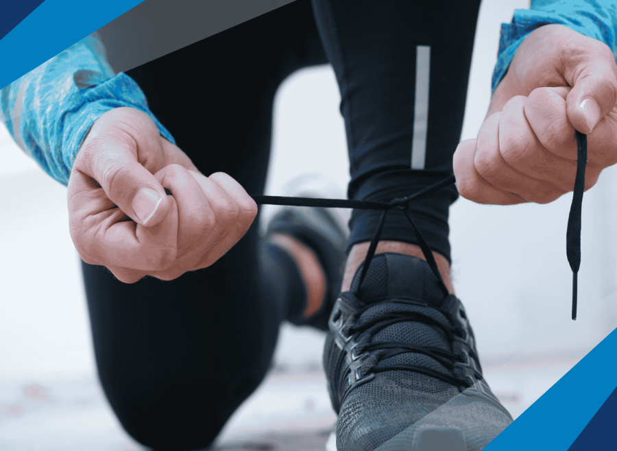 Person lacing up shoe. 