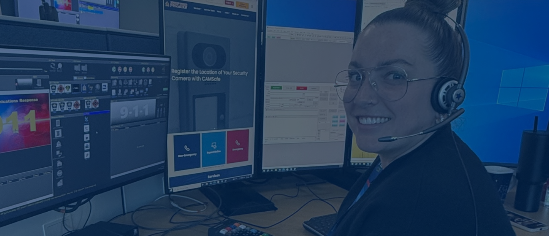 A communicator wearing their telephone headset and smiling