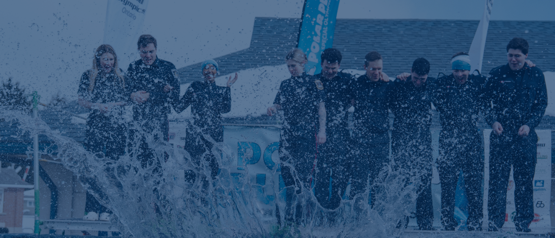 A group of people jumping into cold water