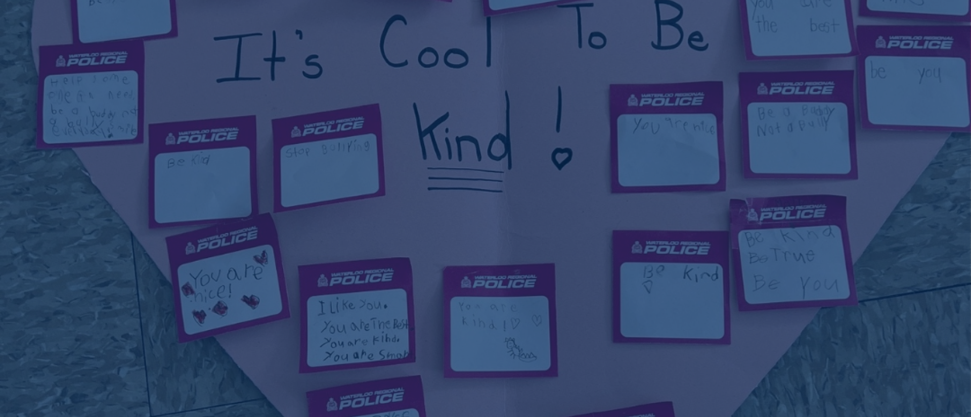 A bunch of pink post-it notes with positive messages written on them