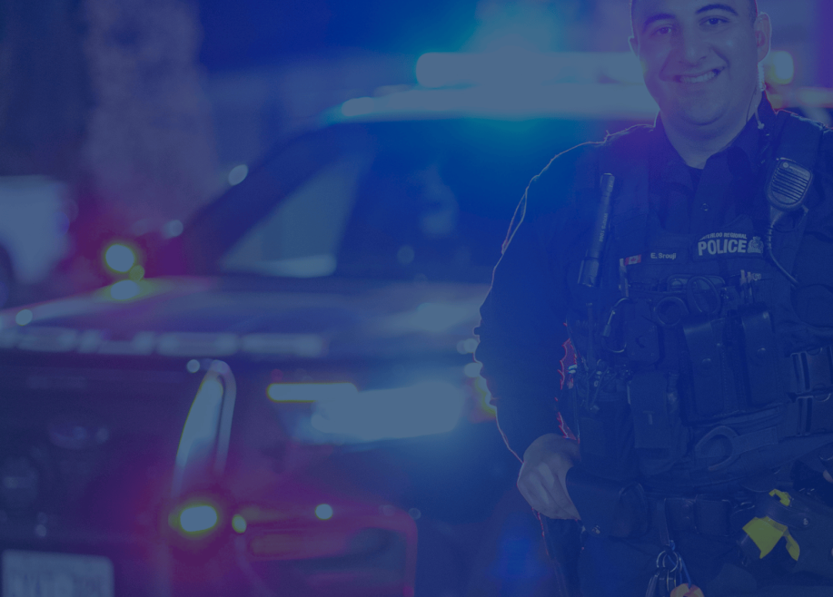 Officer in front of cruiser